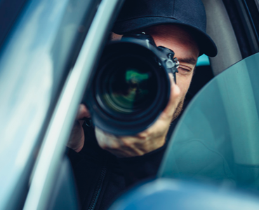 Person in a car with a camera