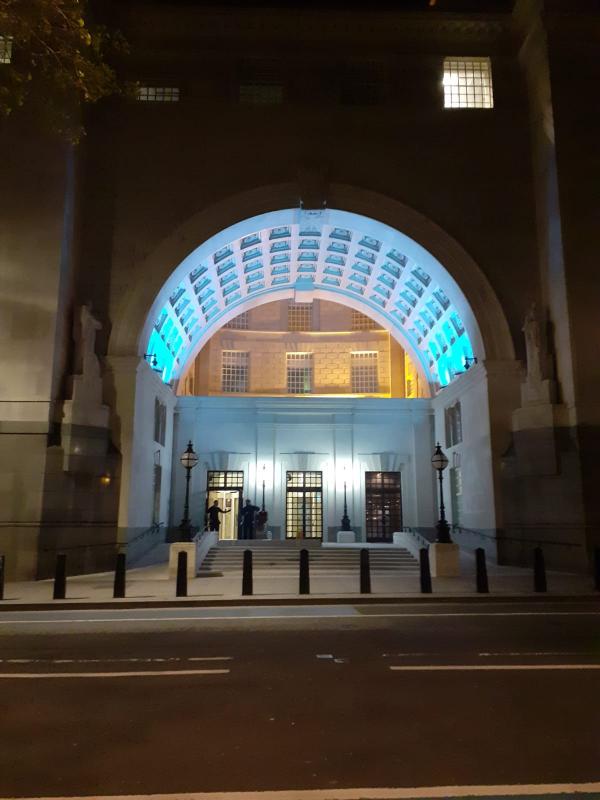 The entrance to MI5 headquarters lit up blue for carers
