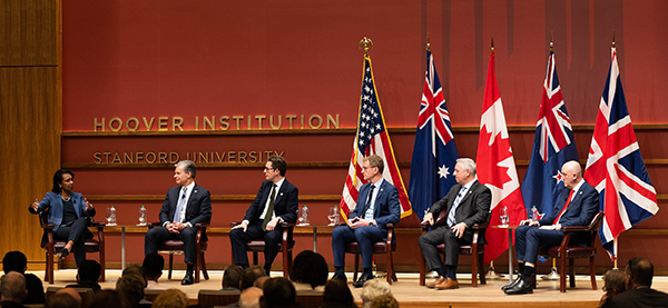The heads of the Five Eyes domestic intelligence agencies on the stage at Stanford University